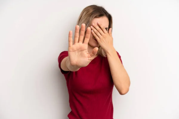 Young Adult Blonde Woman Covering Face Hand Putting Other Hand — Stockfoto