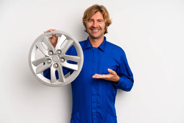 Adult Blond Man Smiling Cheerfully Feeling Happy Showing Concept Car — Fotografia de Stock