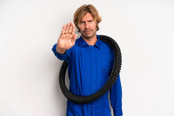 Adult Blond Man Looking Serious Showing Open Palm Making Stop — Stok fotoğraf