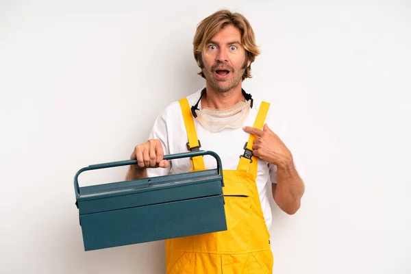 Adult Blond Man Feeling Happy Pointing Self Excited Repairman Toolbox — Stockfoto