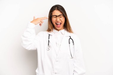 Asyalı genç kadın mutsuz ve stresli görünüyor, intihar jesti silah işareti yapıyor. doktor konsepti