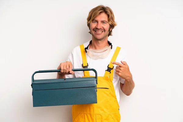 Adult Blond Man Smiling Cheerfully Feeling Happy Pointing Side Repairman — Stockfoto