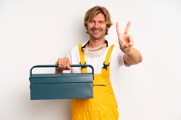 Adult Blond Man Smiling Looking Friendly Showing Number Two Repairman — Zdjęcie stockowe