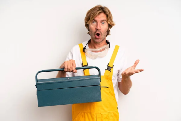 Adult Blond Man Feeling Extremely Shocked Surprised Repairman Toolbox Concept — Stock fotografie