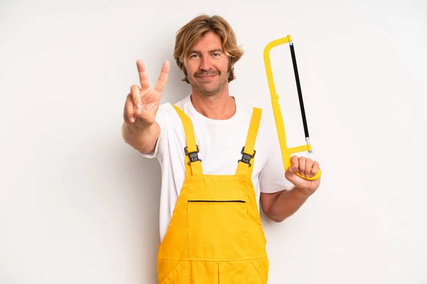 Adult Blond Man Smiling Looking Friendly Showing Number Two Handyman — Stockfoto