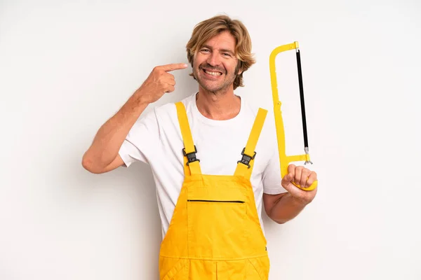 Adult Blond Man Smiling Confidently Pointing Own Broad Smile Handyman — Stockfoto