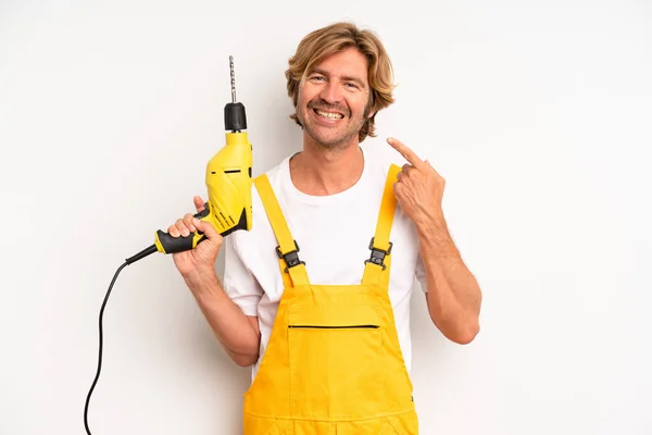 Adult Blond Man Smiling Confidently Pointing Own Broad Smile Handyman — Stock Photo, Image