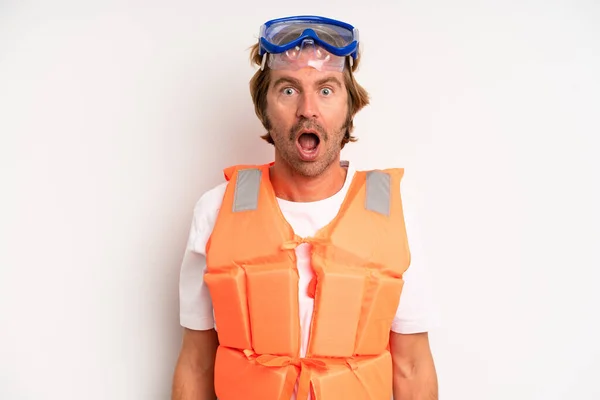 Adult Blond Man Looking Very Shocked Surprised Life Jacket Concept — Photo