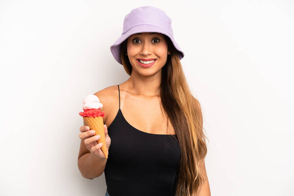 asian young woman looking happy and pleasantly surprised. summer and ice cream concept