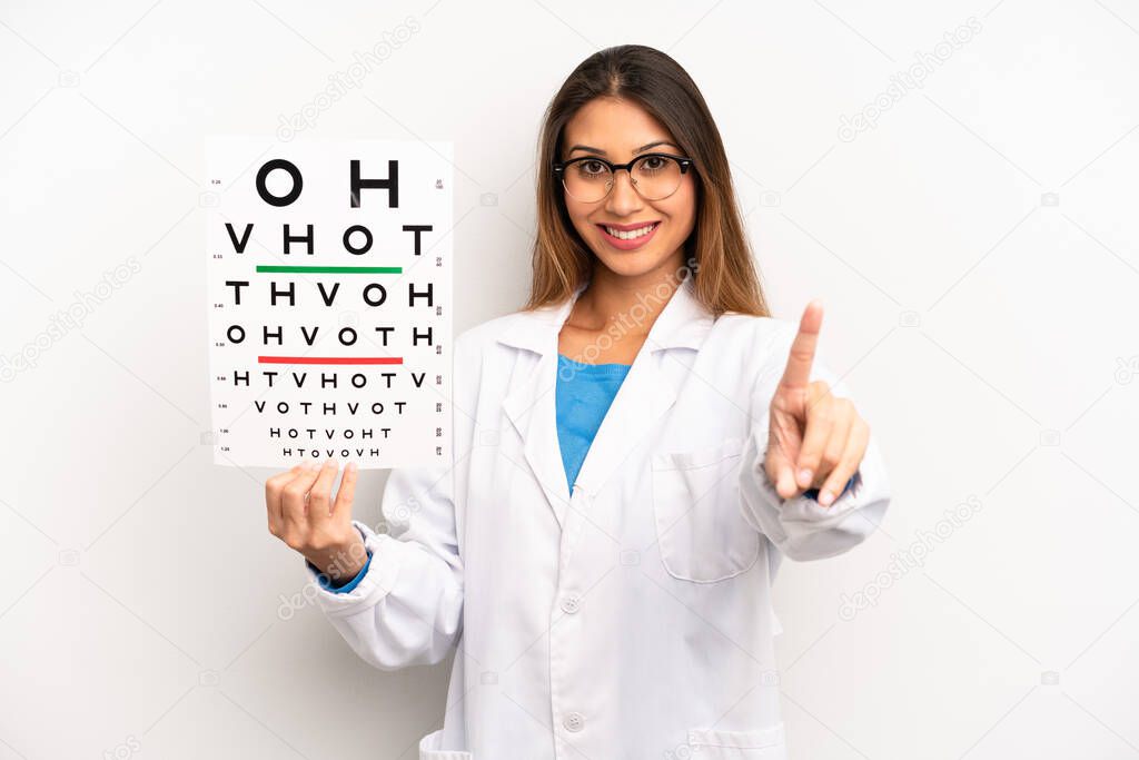 asian young woman smiling proudly and confidently making number one. optical vision test concept