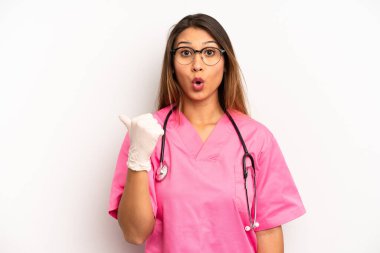 asian young woman looking astonished in disbelief. veterinarian student concept