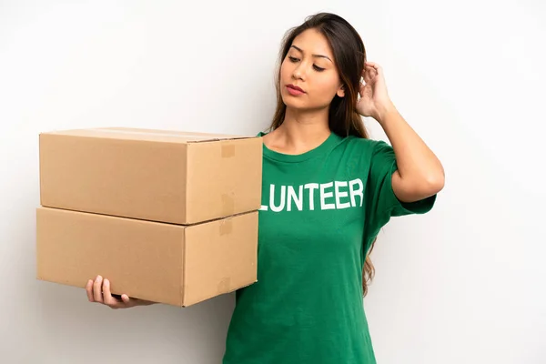 Asian Young Woman Feeling Puzzled Confused Scratching Head Donation Volunteer — Foto Stock