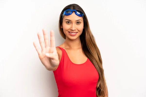 Asian Young Woman Smiling Looking Friendly Showing Number Four Swimmer — Stock Photo, Image