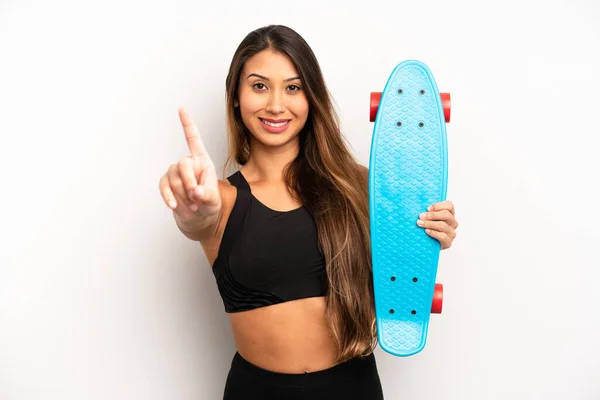 Asian Young Woman Smiling Proudly Confidently Making Number One Skate — Stockfoto