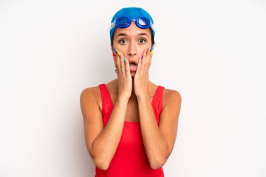 hispanic pretty woman feeling shocked and scared. swimmer concept