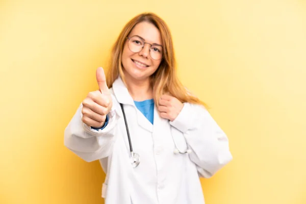Pretty Blonde Young Woman Feeling Proud Smiling Positively Thumbs Physician — Zdjęcie stockowe