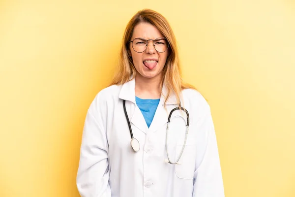 Pretty Blonde Young Woman Feeling Disgusted Irritated Tongue Out Physician — Zdjęcie stockowe