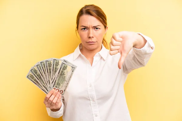 Pretty Blonde Young Woman Feeling Cross Showing Thumbs Dollar Banknotes — Stockfoto