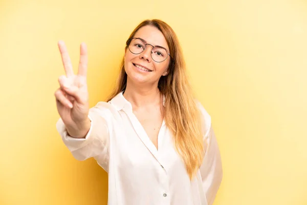 Blonde Pretty Woman Smiling Looking Happy Carefree Positive Gesturing Victory — Stock Photo, Image