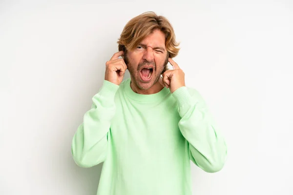 Blond Adult Man Looking Angry Stressed Annoyed Covering Both Ears —  Fotos de Stock