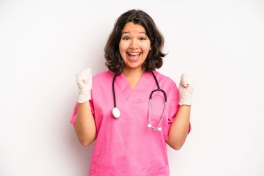 hispanic pretty girl feeling stressed, anxious or scared, with hands on head. nurse concept