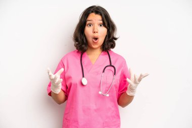 hispanic pretty girl looking puzzled and confused. nurse concept