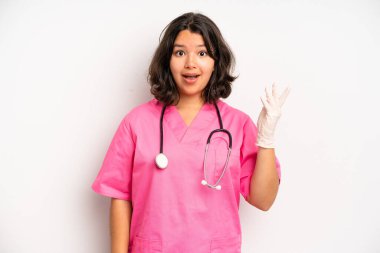 hispanic pretty girl feeling disgusted and irritated and tongue out. nurse concept