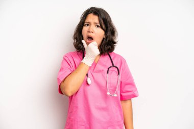 hispanic pretty girl feeling puzzled and confused and doubting. nurse concept