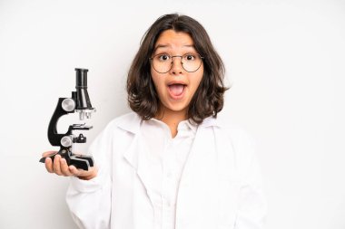 hispanic pretty girl with cheerful and rebellious attitude, joking and sticking tongue out. science student