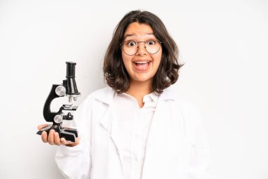 hispanic pretty girl screaming with hands up in the air. science student
