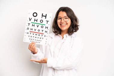 hispanic pretty girl making capice or money gesture, telling you to pay. optical vision test concept