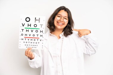 hispanic pretty girl looking astonished in disbelief. optical vision test concept