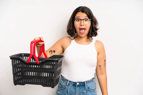 Hispanic Pretty Girl Looking Very Shocked Surprised Empty Shopping Basket — Stockfoto