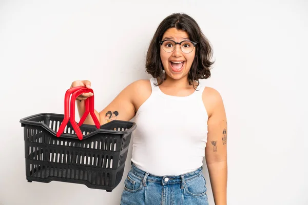 Hispanic Pretty Girl Looking Happy Pleasantly Surprised Empty Shopping Basket — Foto Stock