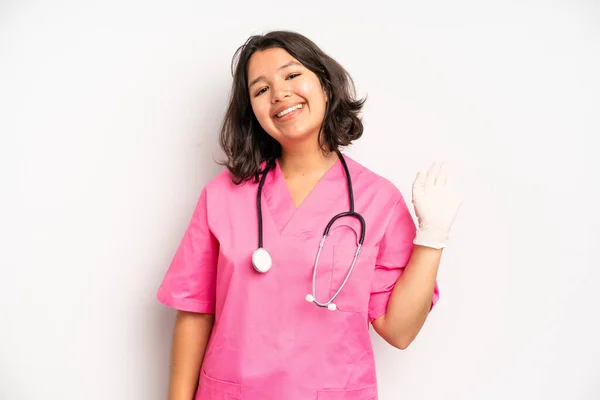 Hispanic Pretty Girl Smiling Cheerfully Feeling Happy Pointing Side Nurse — Stock Photo, Image