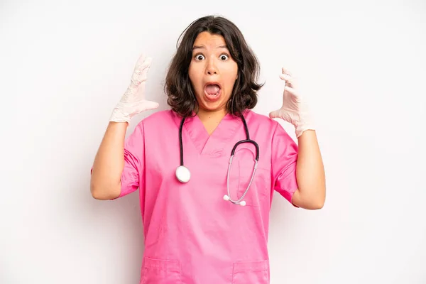 Hispanic Pretty Girl Covering Mouth Hands Shocked Nurse Concept — Stock fotografie