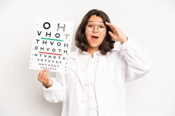 Hispanic Pretty Girl Looking Very Shocked Surprised Optical Vision Test —  Fotos de Stock