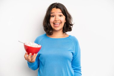 hispanic pretty girl feeling puzzled and confused. breakfast concept