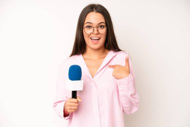 hispanic pretty woma feeling sad and whiney with an unhappy look and crying. journalist with a microphone