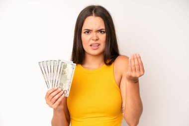 hispanic pretty woma feeling like a happy and excited genius after realizing an idea. dollar banknotes concept