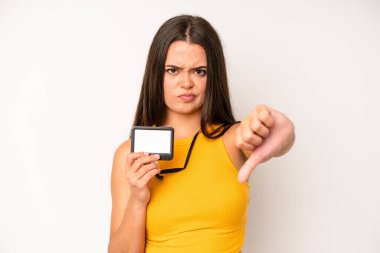 hispanic pretty woma looking arrogant, successful, positive and proud. vip pass id card concept