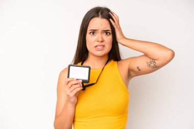 hispanic pretty woma shouting aggressively, looking very angry. vip pass id card concept