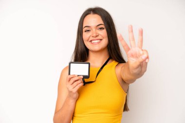 hispanic pretty woma screaming with hands up in the air. vip pass id card concept