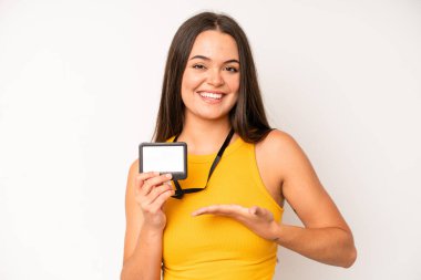 hispanic pretty woma feeling extremely shocked and surprised. vip pass id card concept