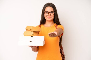 hispanic pretty woma amazed, shocked and astonished with an unbelievable surprise. delivery take away concept