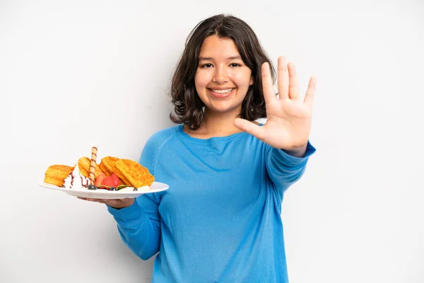 Hispanic Pretty Girl Smiling Cheerfully Feeling Happy Pointing Side Waffles — Stockfoto