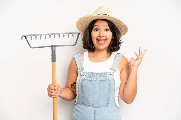 Hispanic Pretty Girl Looking Desperate Frustrated Stressed Farmer Rake Concept — Stock fotografie