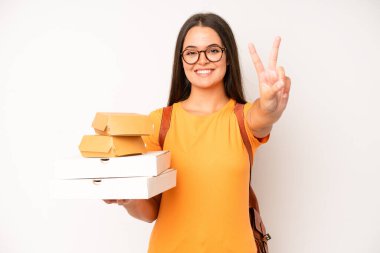 hispanic pretty woma feeling disgusted and irritated and tongue out. delivery take away concept