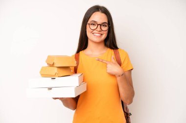 hispanic pretty woma shouting aggressively with an angry expression. delivery take away concept