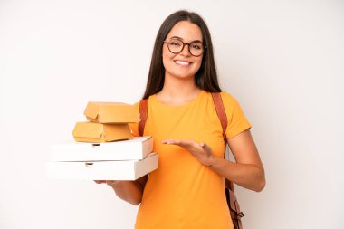 hispanic pretty woma feeling extremely shocked and surprised. delivery take away concept